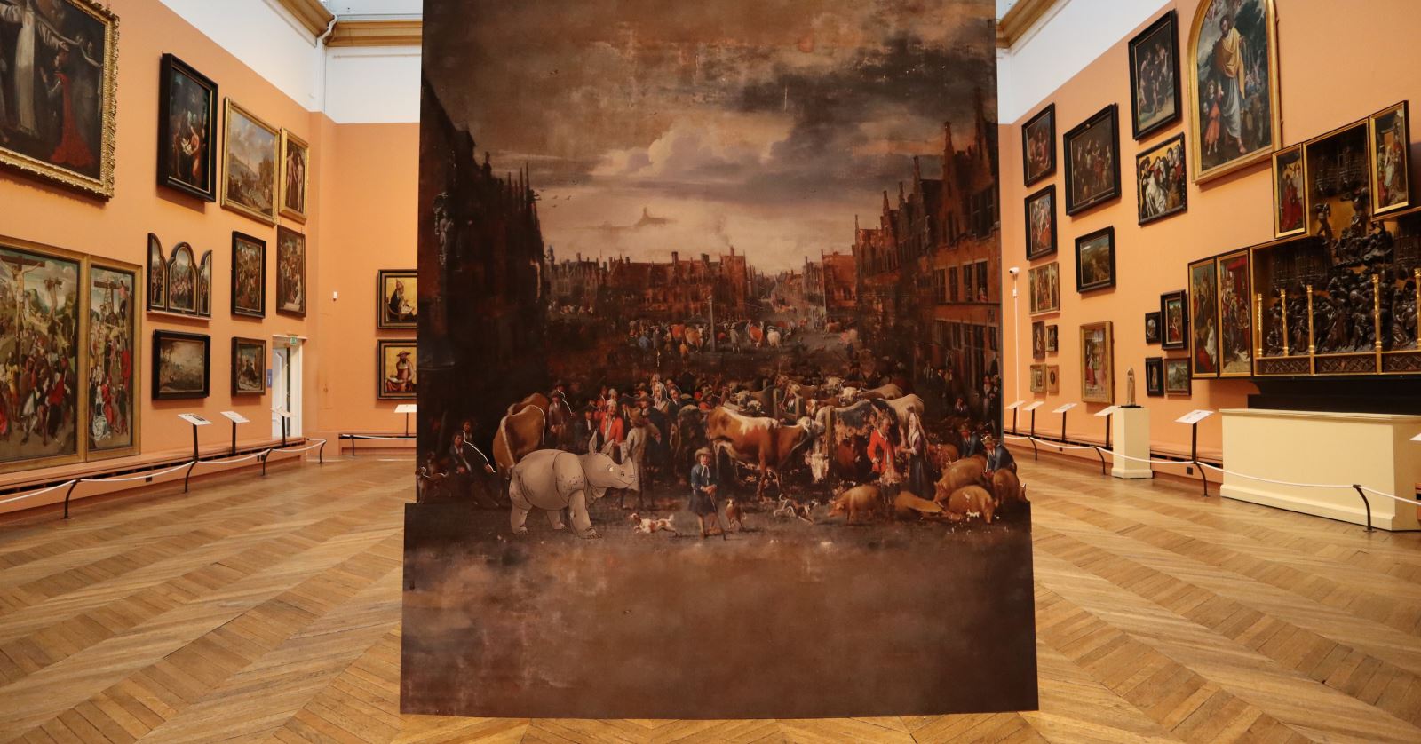 View of the gallery space within The Bowes Museum - walls covered in paintings